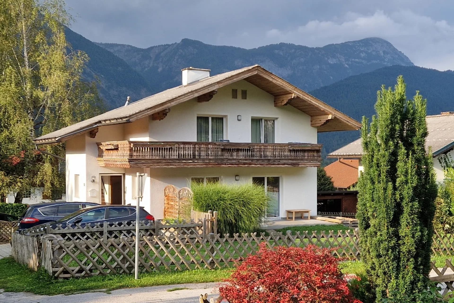 Dining area in Haus Montis apartment with smart TV and seating for family meals
